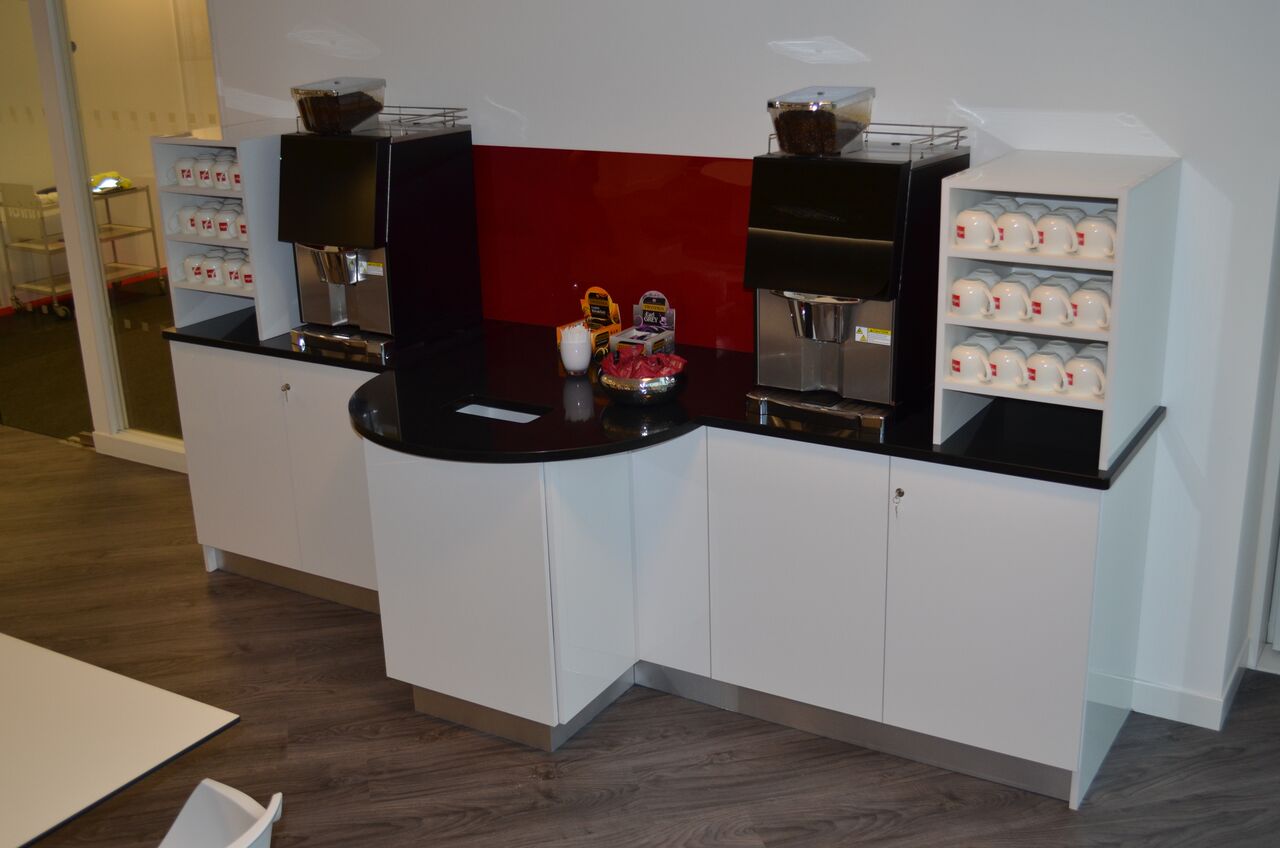 Image of a corporate office coffee point unit and shelves