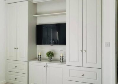 Image of bedroom wardrobes with TV and joining cornice